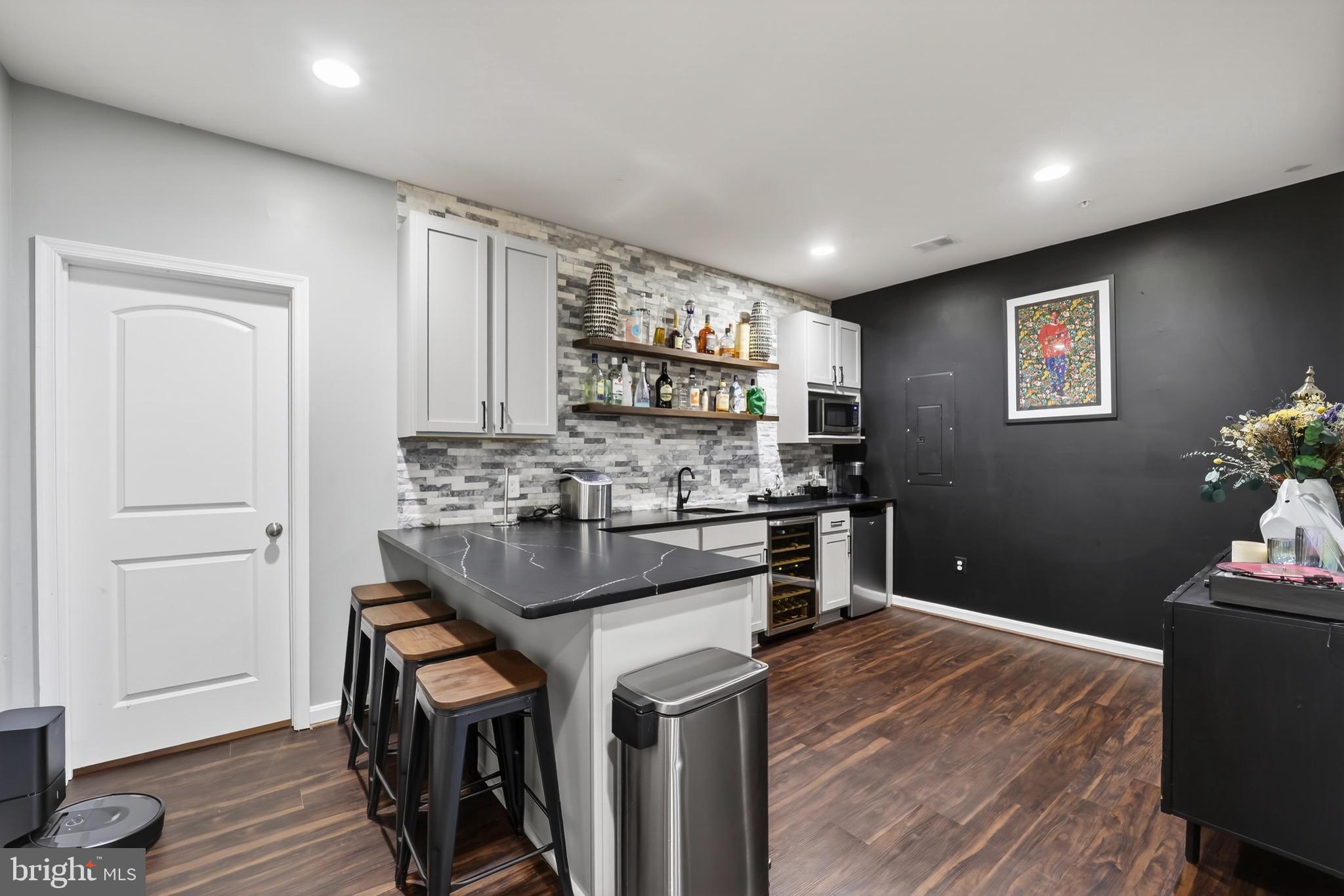9205 Rice Avenue Lanham, MD 20706 - Photo 42 of 68 a kitchen with stainless steel appliances granite countertop a refrigerator and a stove top oven