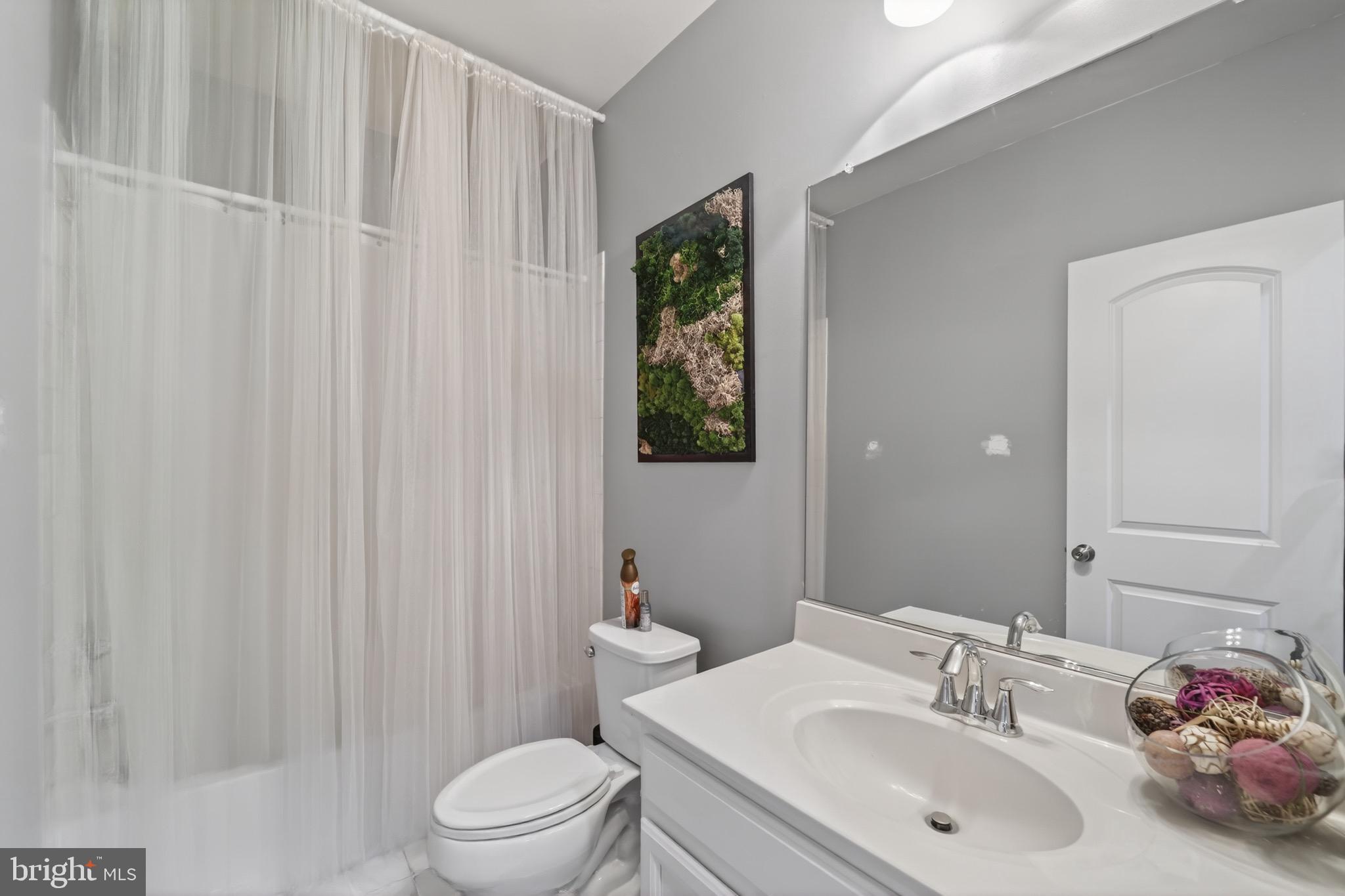 9205 Rice Avenue Lanham, MD 20706 - Photo 47 of 68 a bathroom with a sink toilet and shower