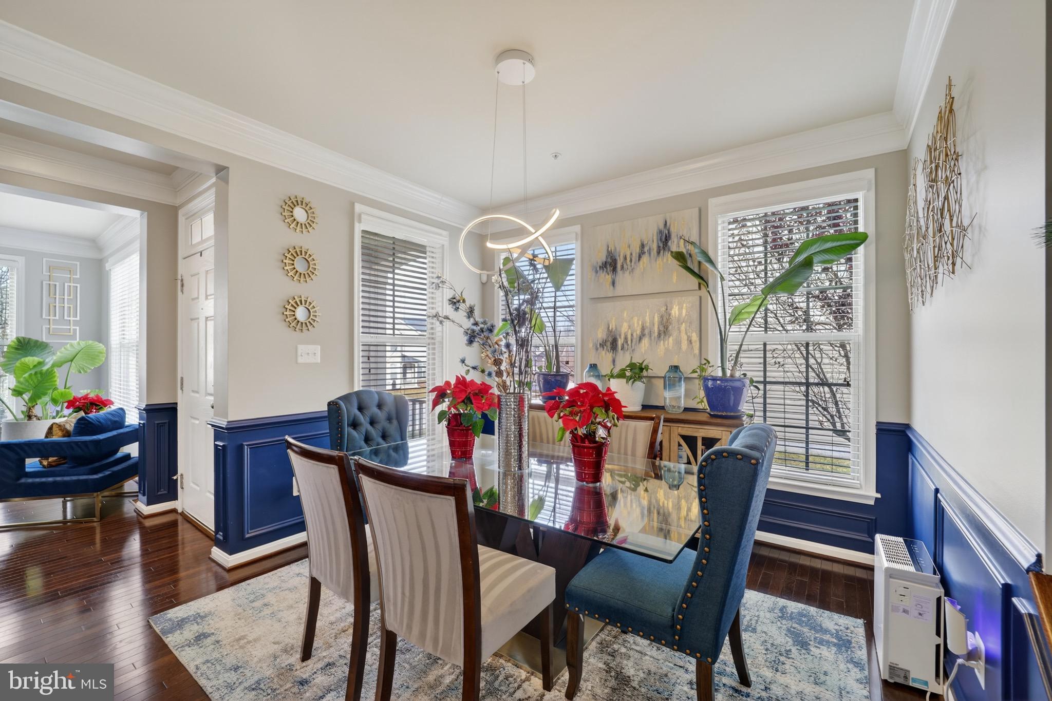 9205 Rice Avenue Lanham, MD 20706 - Photo 7 of 68 a view of a dining room with furniture window and wooden floor