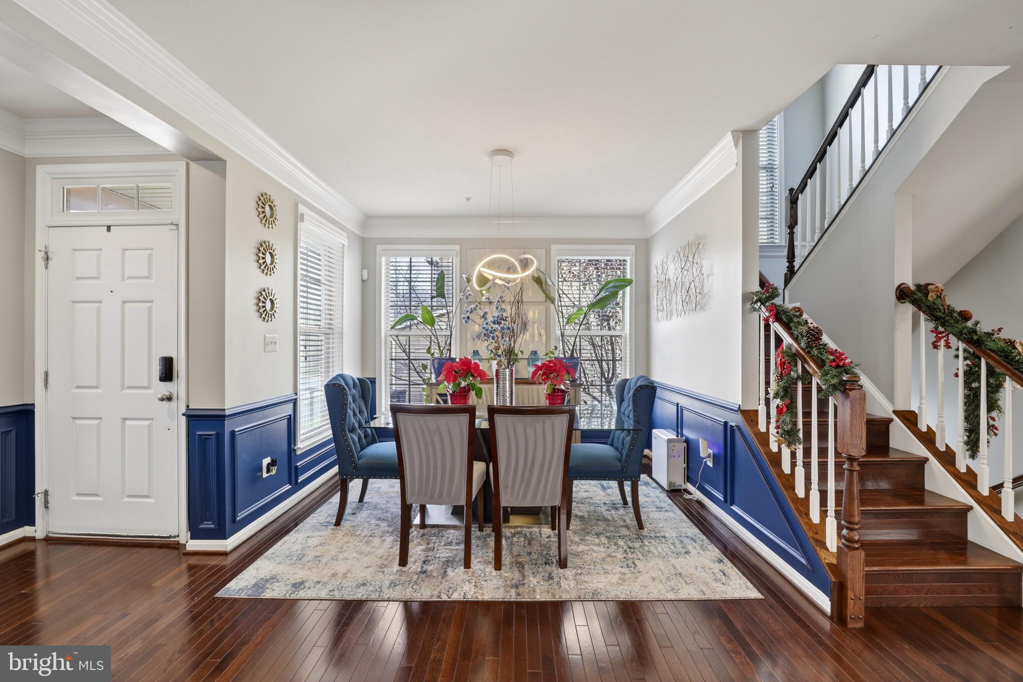 9205 Rice Avenue Lanham, MD 20706 - Photo 8 of 68 a view of a dining room with furniture window and wooden floor