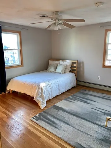 a bedroom with bed and window