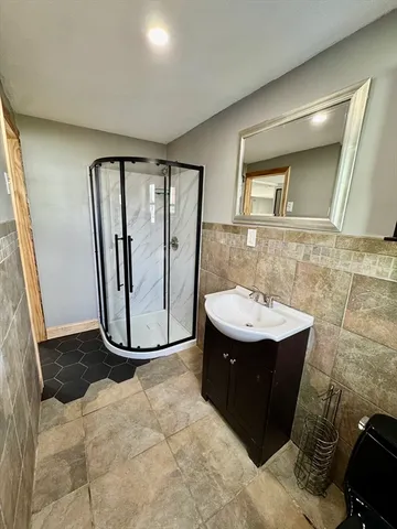 a view of a bathroom with a sink and mirror