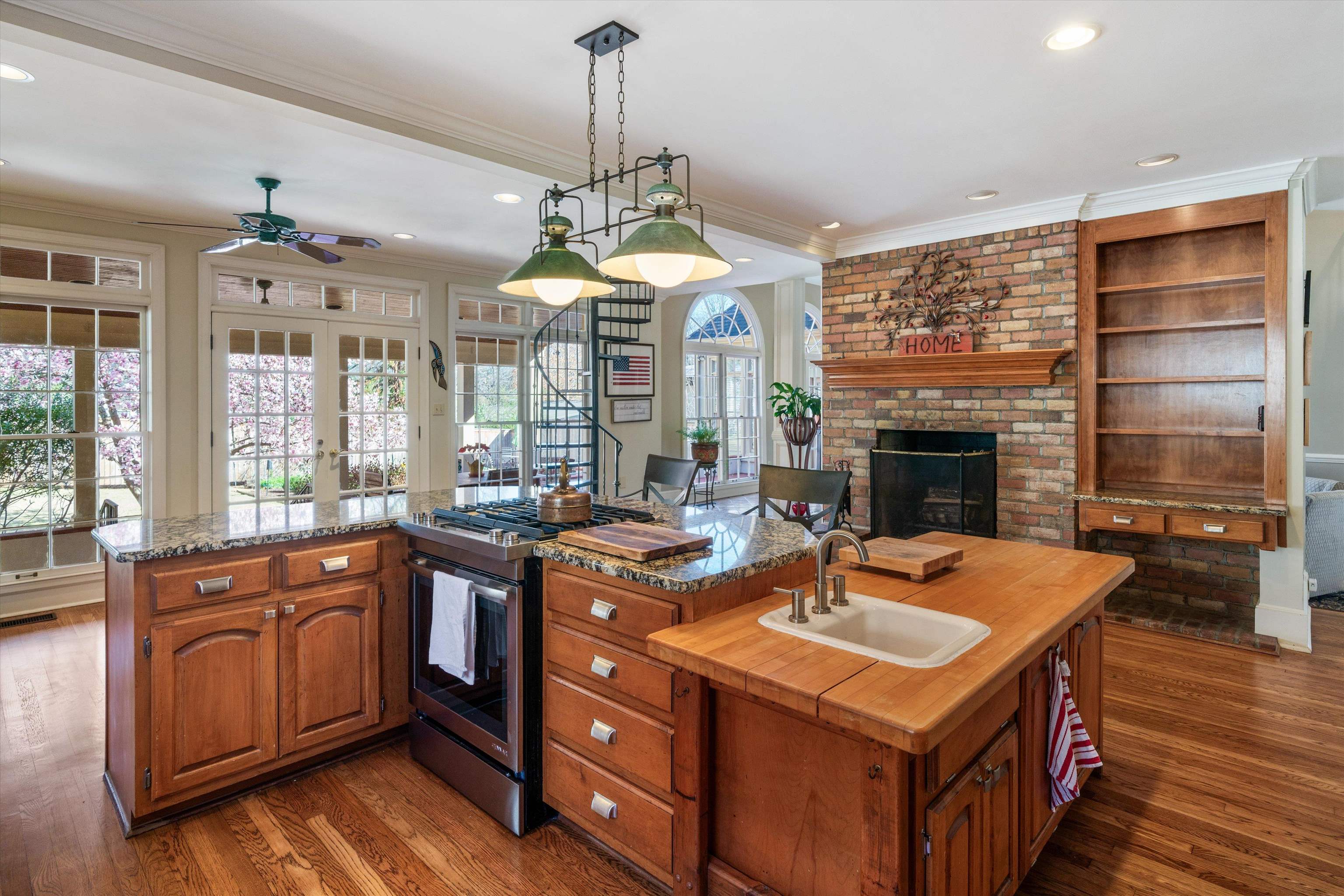 352 Colonial Road Memphis, TN 38117 - Photo 8 of 31 a kitchen with a sink stove and cabinets