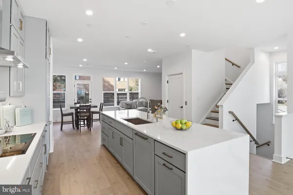 a kitchen with a sink a counter top space and appliances
