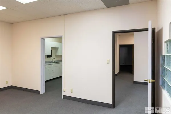 a view of an empty room and fire place
