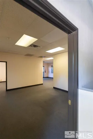 a view of a room with a hallway