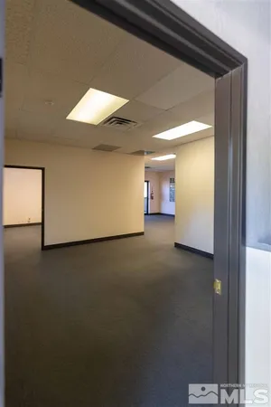 a view of a room with a hallway