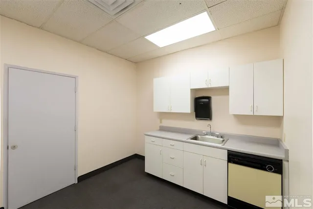 a view of cabinets with wooden floor