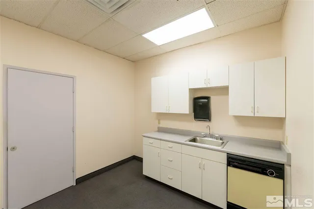 a view of cabinets with wooden floor