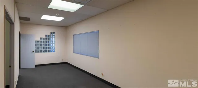 a view of an empty room and window