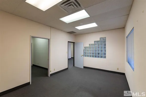 a view of an empty room with a window