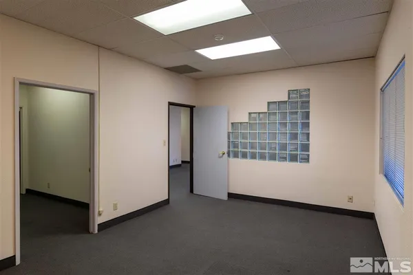 a view of an empty room with a window