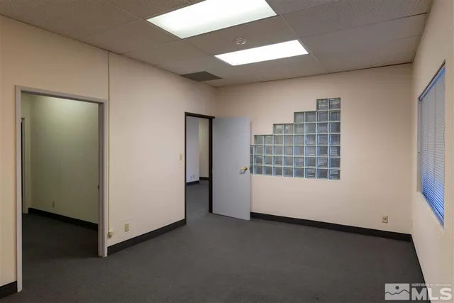 a view of an empty room with a window