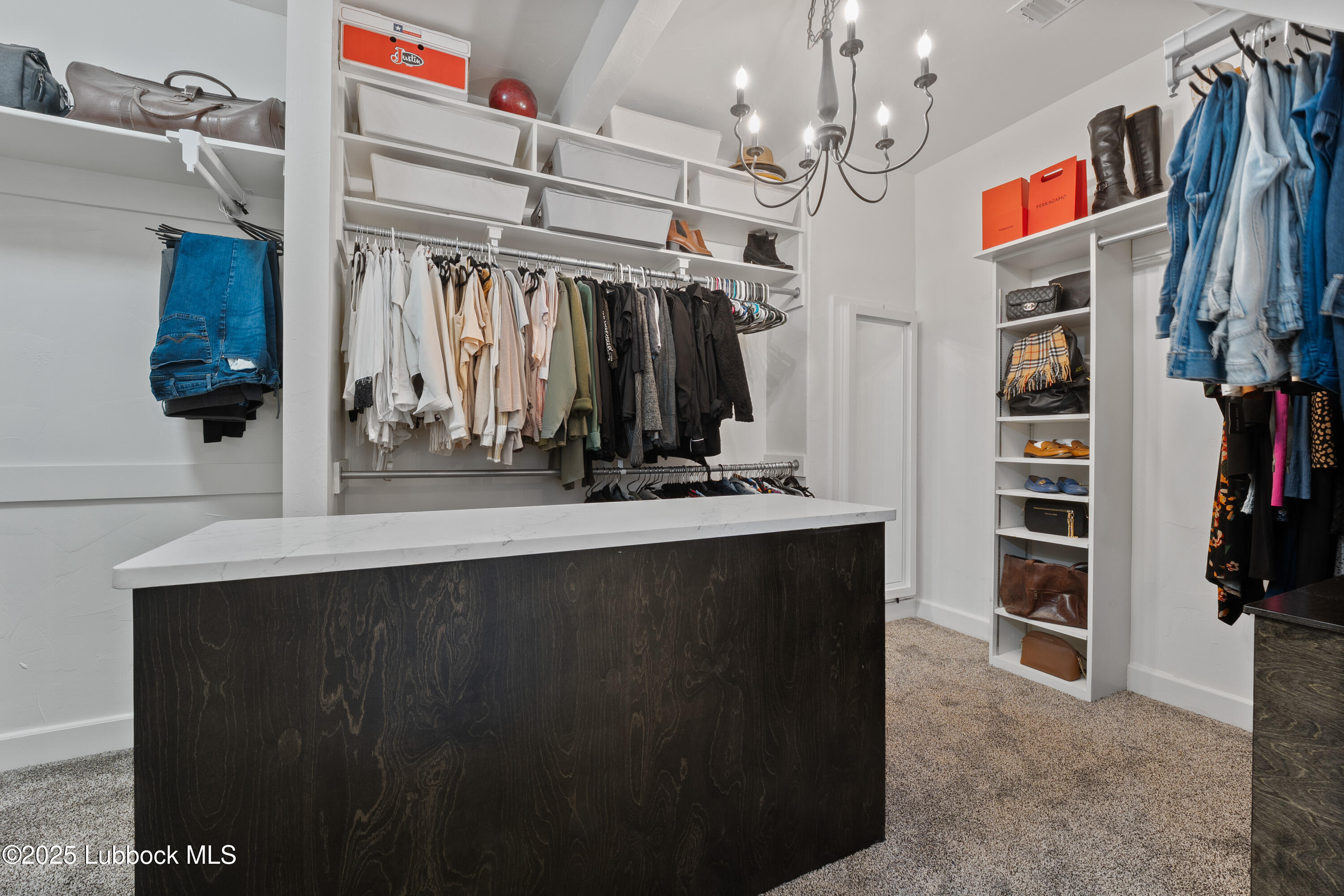 5125 County Road 7930 Lubbock, TX 79424 - Photo 26 of 75 a view of walk in closet with clothes and shoes
