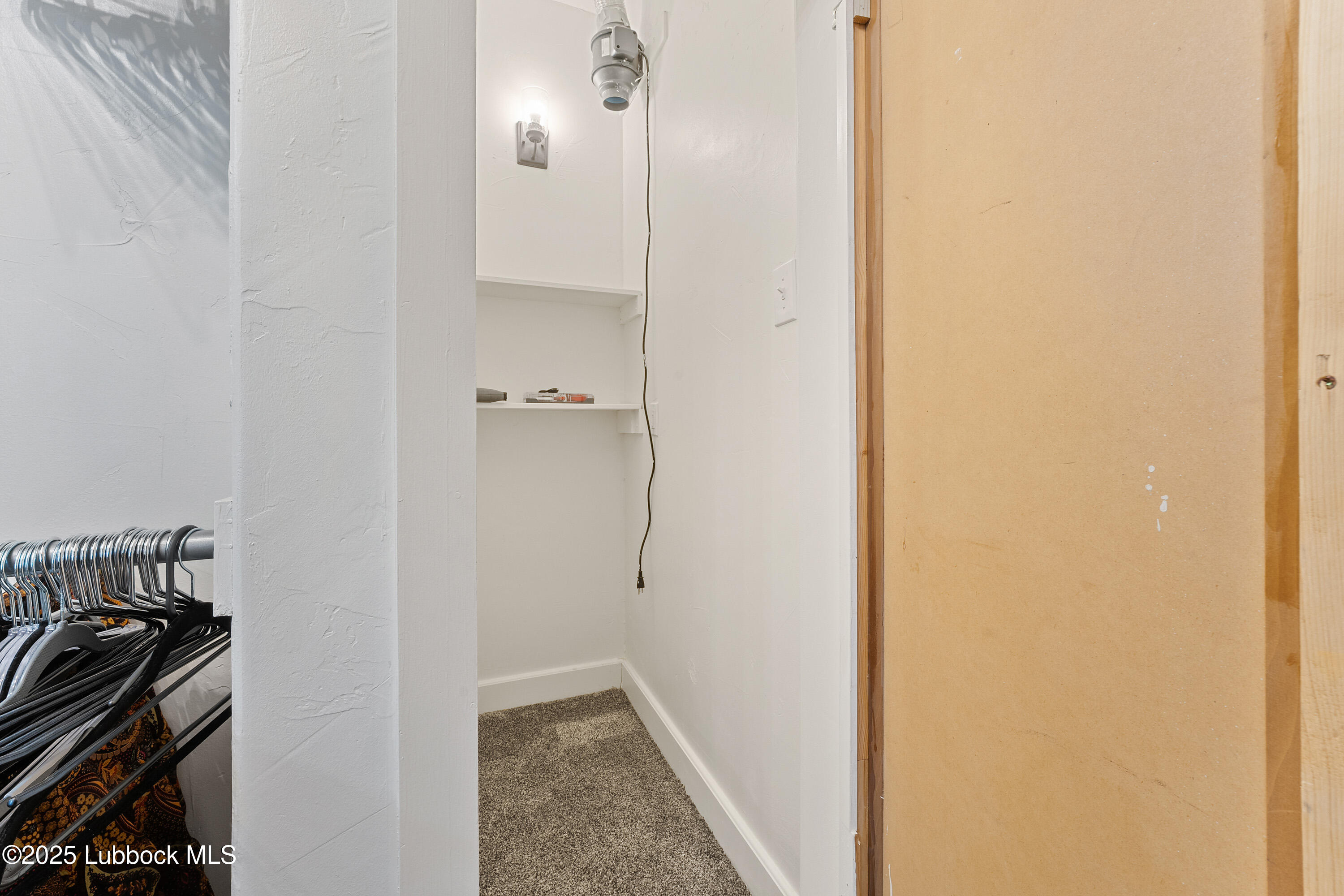 5125 County Road 7930 Lubbock, TX 79424 - Photo 29 of 75 a view of a bathroom from a corridor