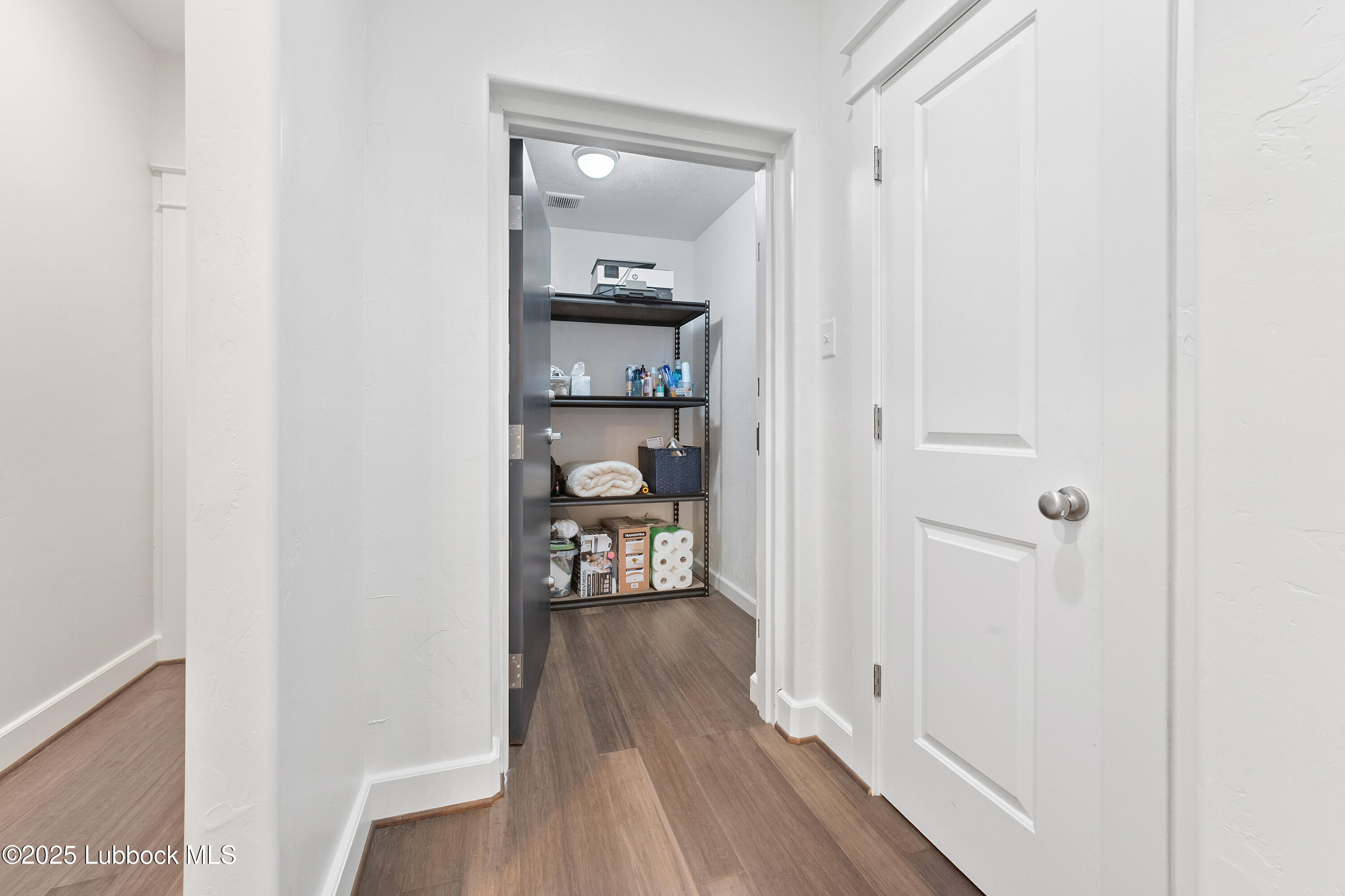 5125 County Road 7930 Lubbock, TX 79424 - Photo 30 of 75 a view of a hallway with wooden floor