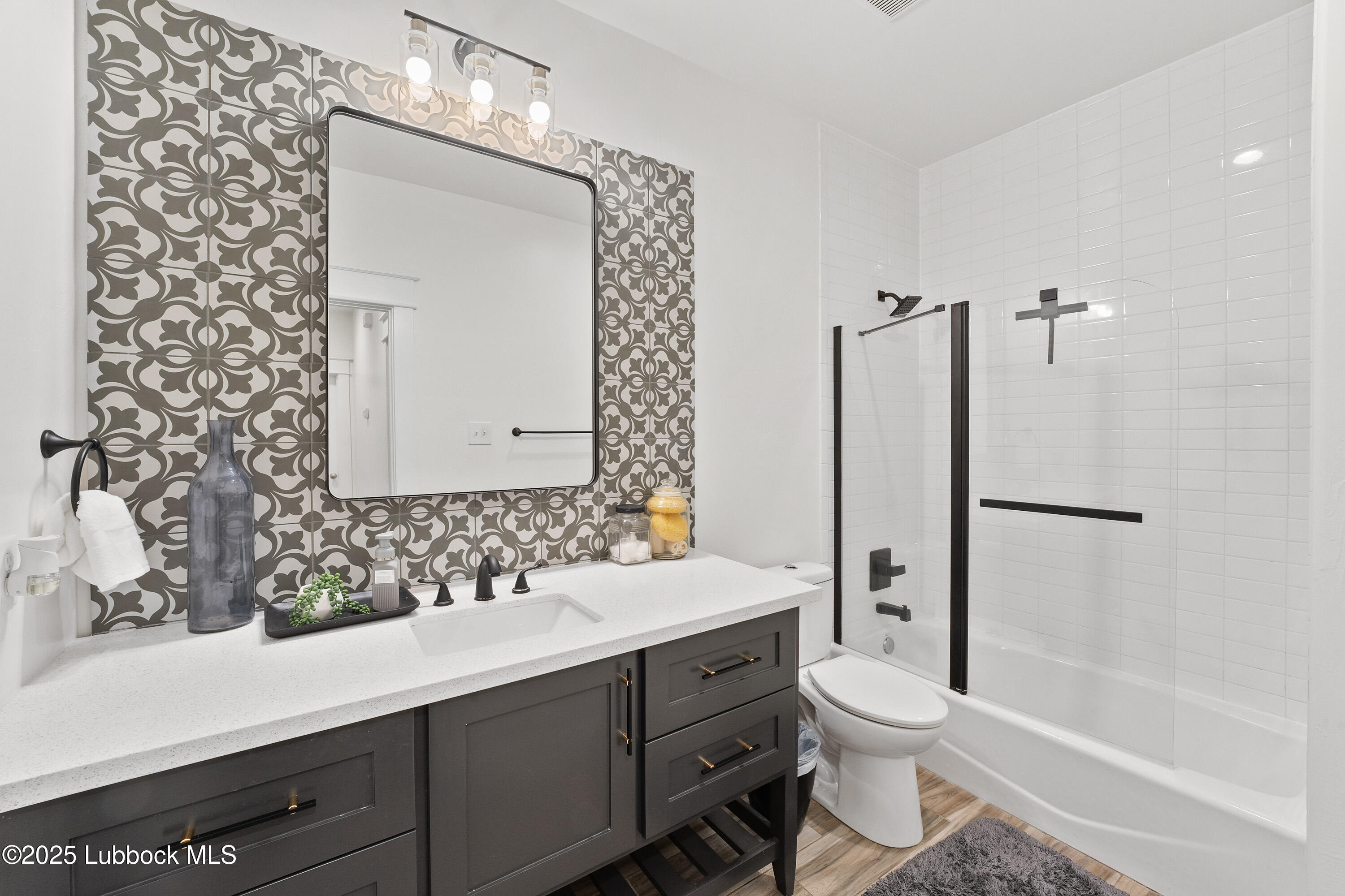 5125 County Road 7930 Lubbock, TX 79424 - Photo 32 of 75 a bathroom with a sink toilet and shower