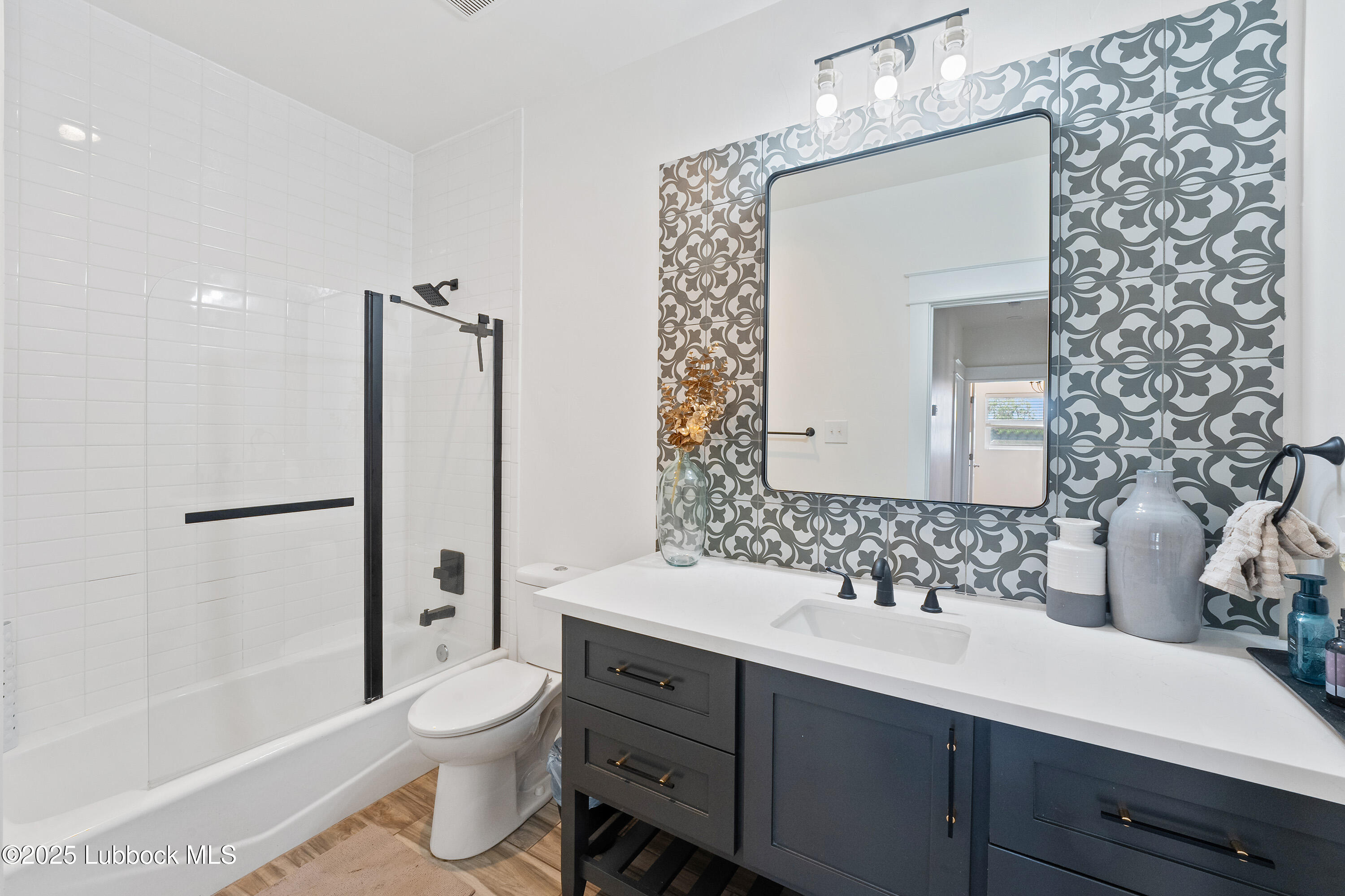 5125 County Road 7930 Lubbock, TX 79424 - Photo 37 of 75 a bathroom with a sink a toilet and shower