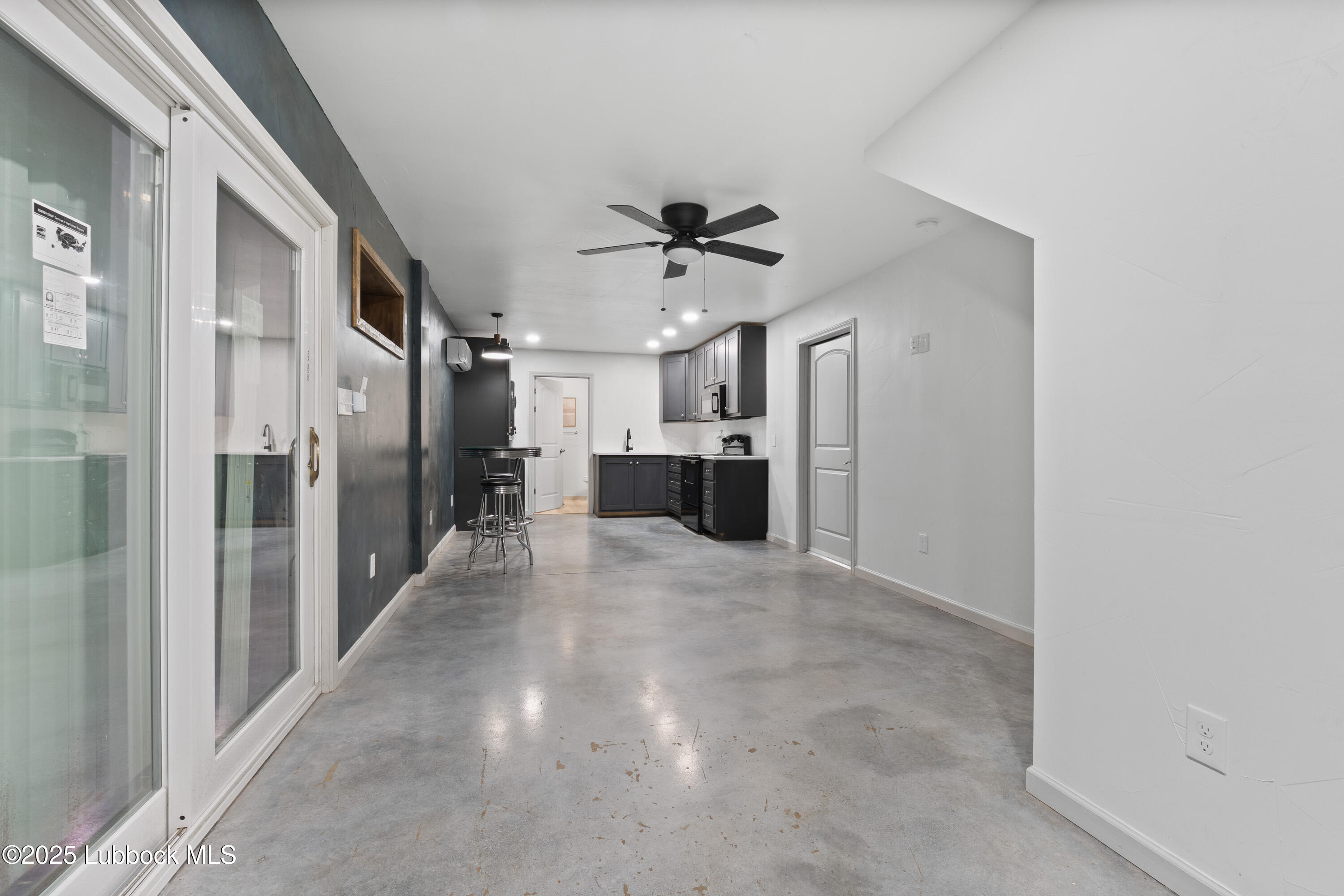 5125 County Road 7930 Lubbock, TX 79424 - Photo 50 of 75 a view of a hallway with a chandelier