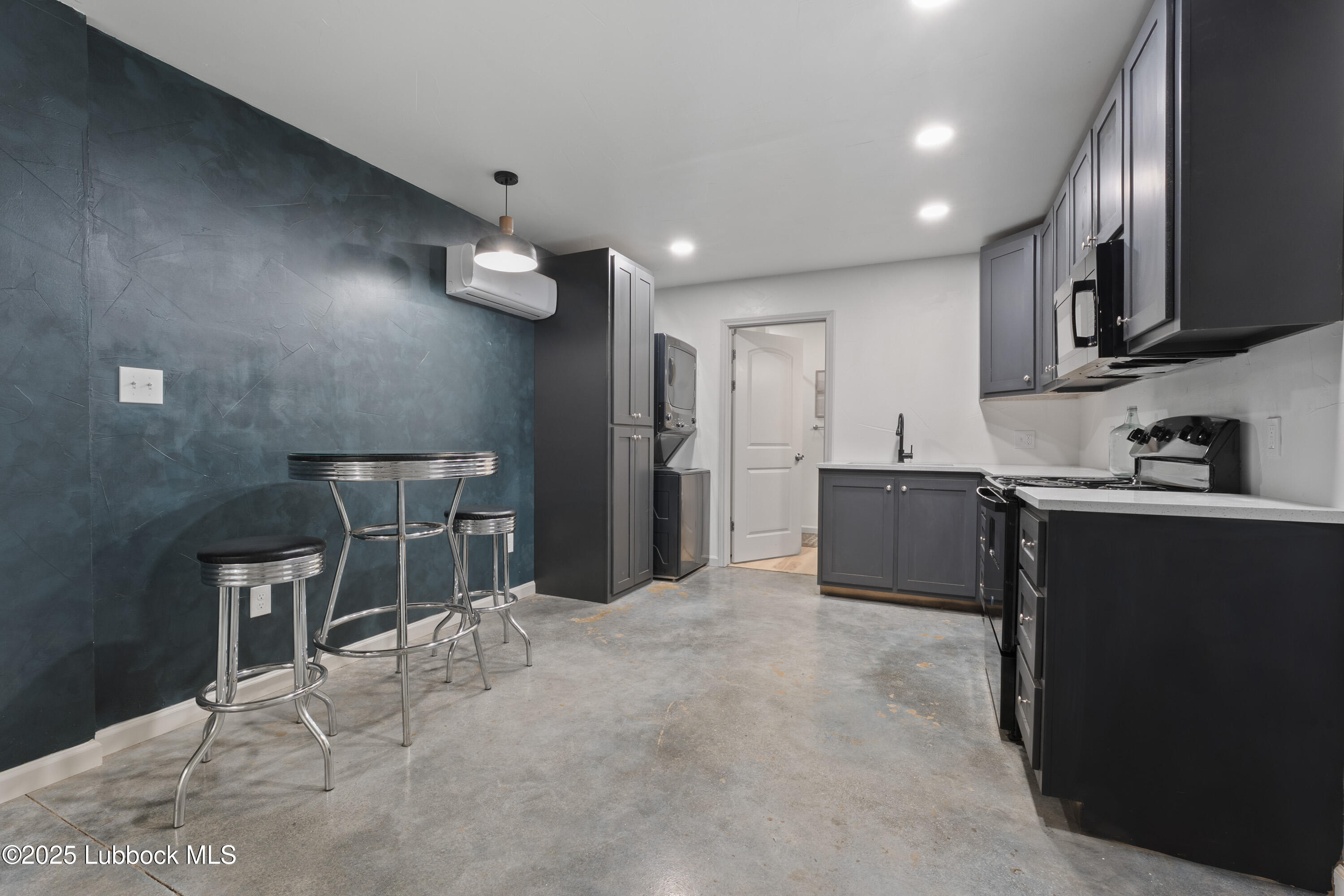 5125 County Road 7930 Lubbock, TX 79424 - Photo 52 of 75 a kitchen with stainless steel appliances kitchen island granite countertop a refrigerator and a sink