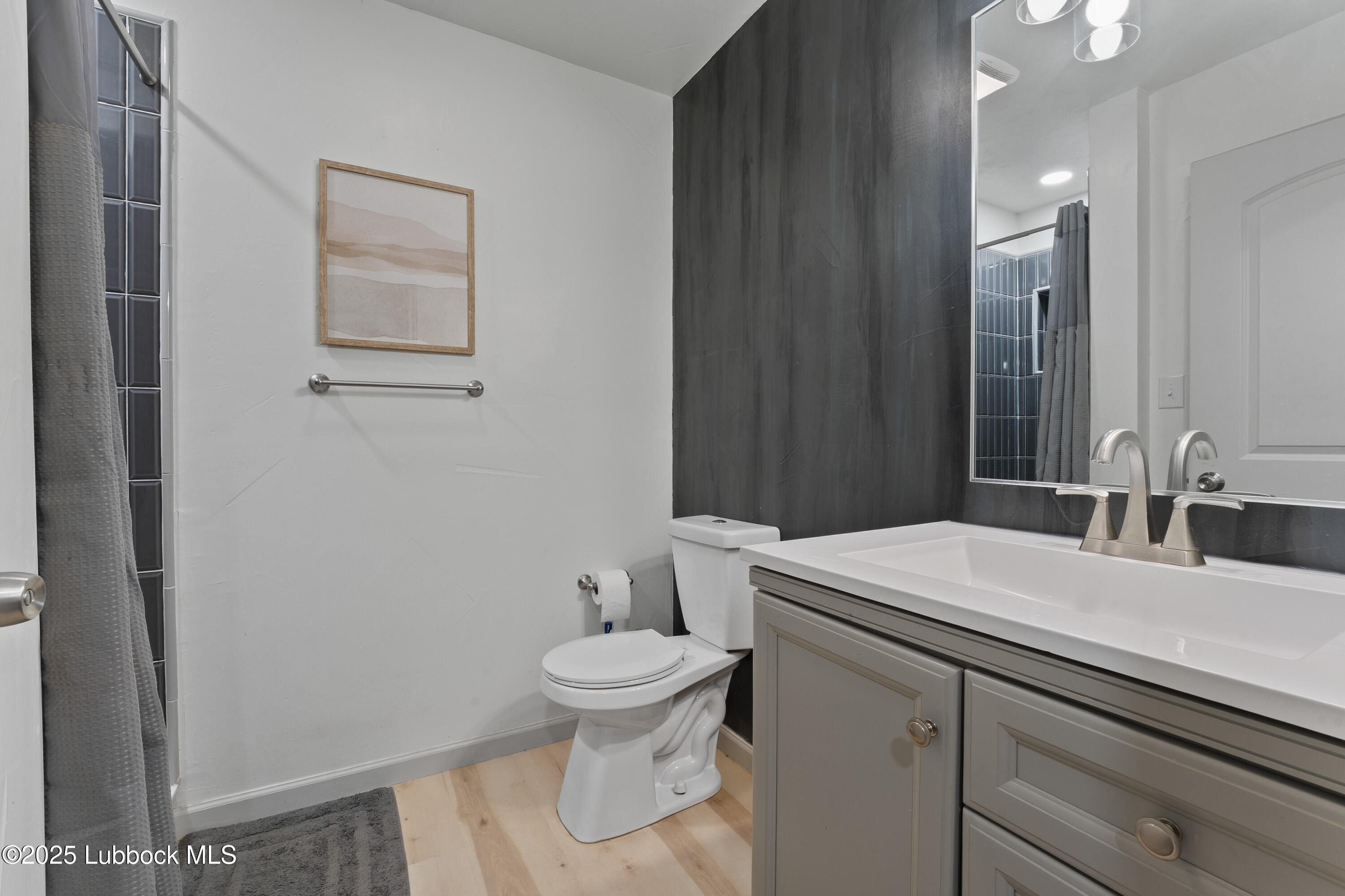 5125 County Road 7930 Lubbock, TX 79424 - Photo 53 of 75 a bathroom with a sink toilet and vanity