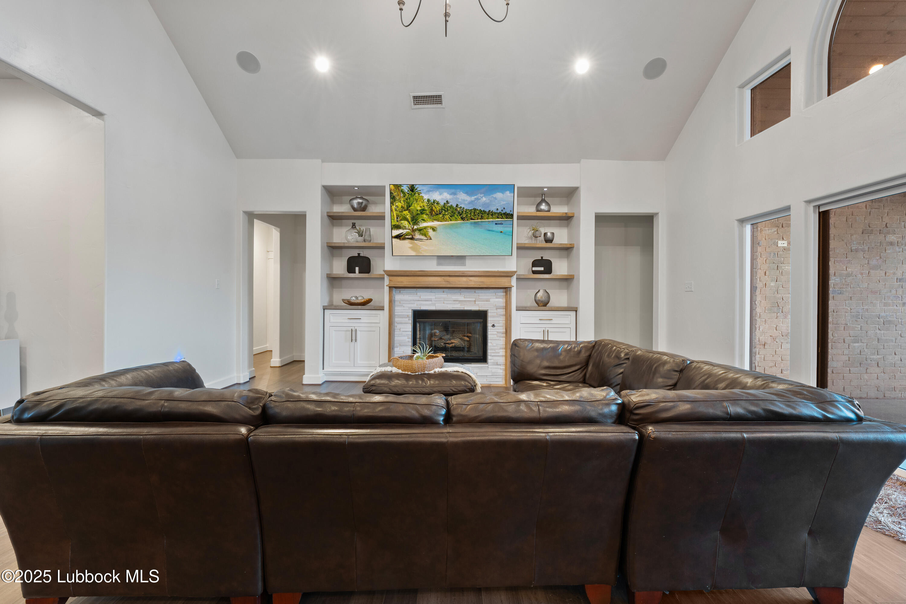 5125 County Road 7930 Lubbock, TX 79424 - Photo 8 of 75 a living room with furniture and a fireplace