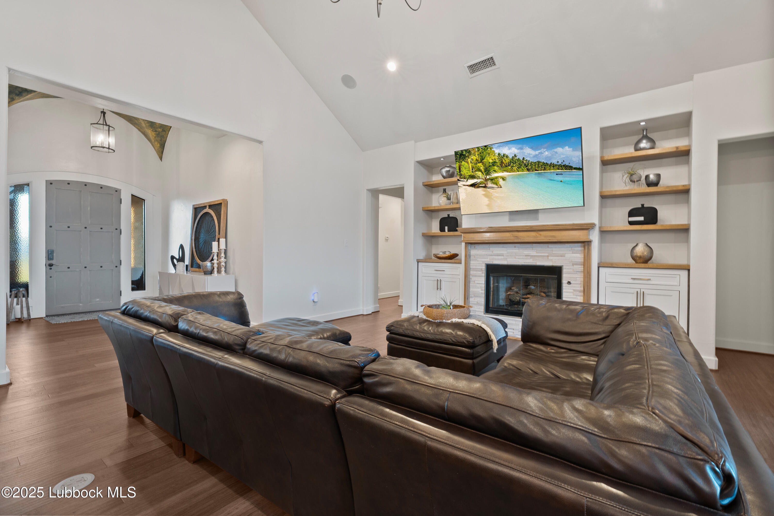 5125 County Road 7930 Lubbock, TX 79424 - Photo 9 of 75 a living room with furniture and a fireplace