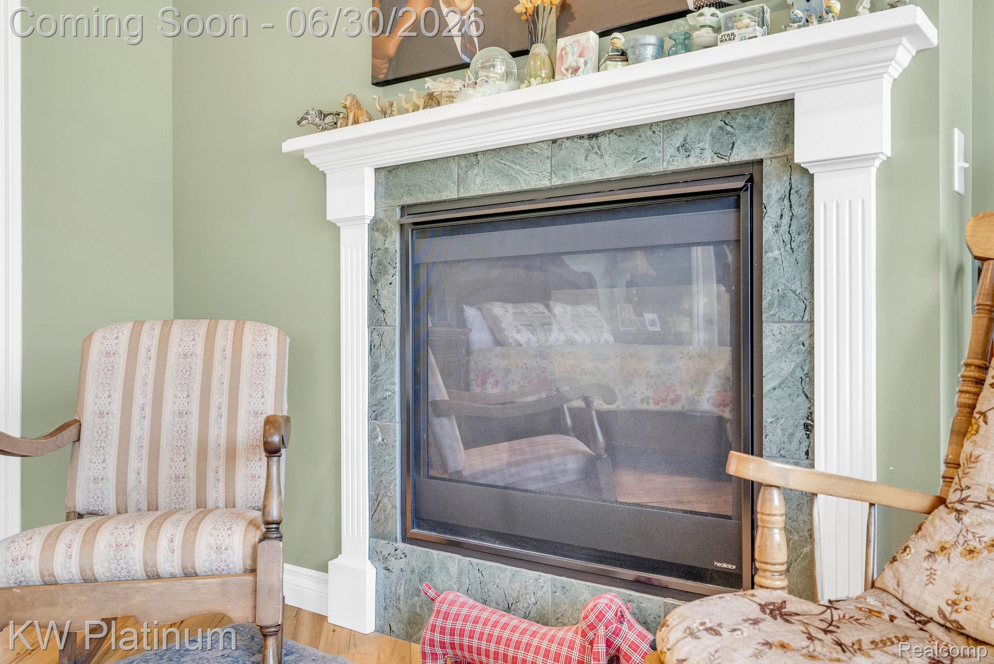 2235 South Lake Shore Road Harbor Beach, MI 48441 - Photo 36 of 99 Fireplace featuring a decorative white mantel, fluted pilasters, and a green stone surround