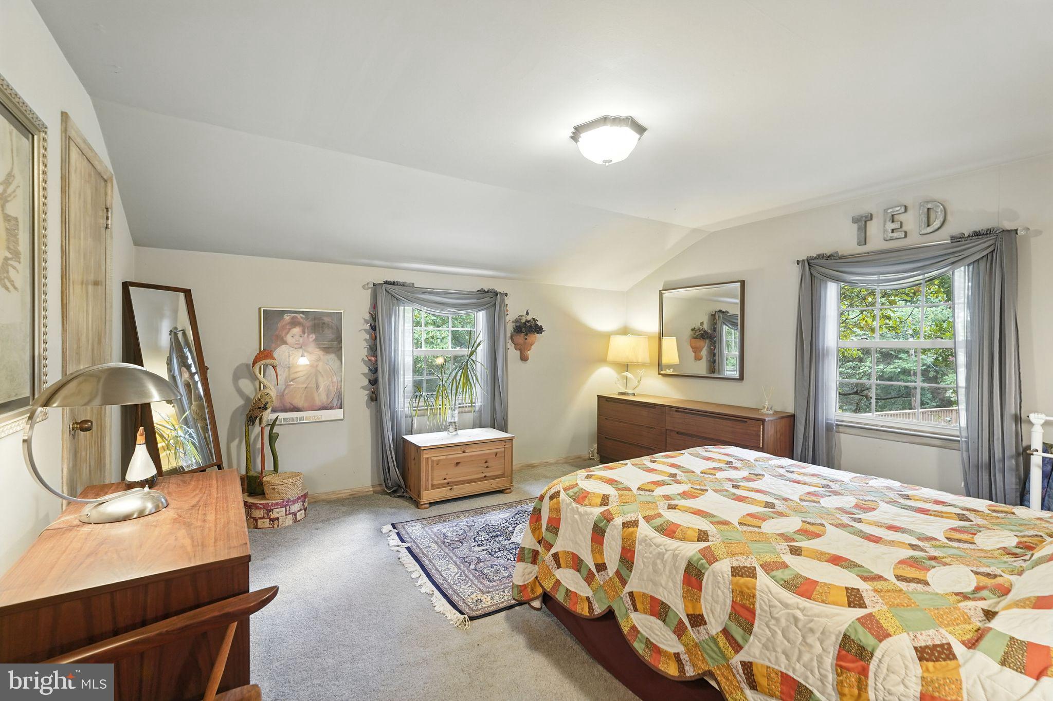 8420 Chippewa Road Philadelphia, PA 19128 - Photo 11 of 30 a bedroom with a large bed and wooden floor
