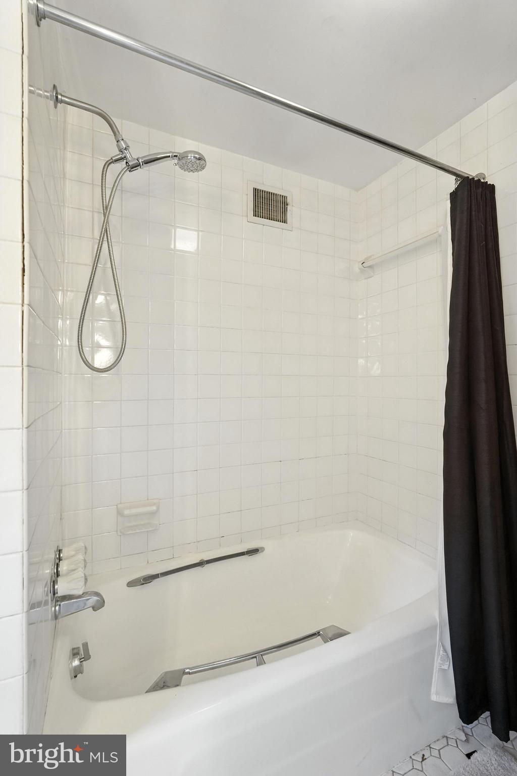 8420 Chippewa Road Philadelphia, PA 19128 - Photo 16 of 30 a bathroom with a shower and a bath tub