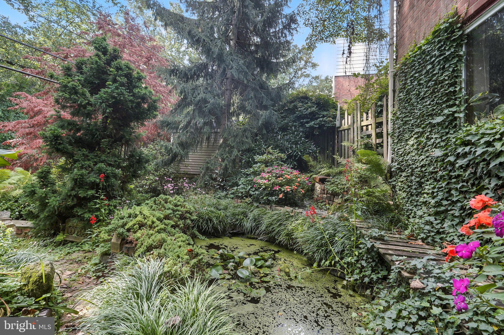 8420 Chippewa Road Philadelphia, PA 19128 - Photo 24 of 30 a view of a garden with plants and flowers