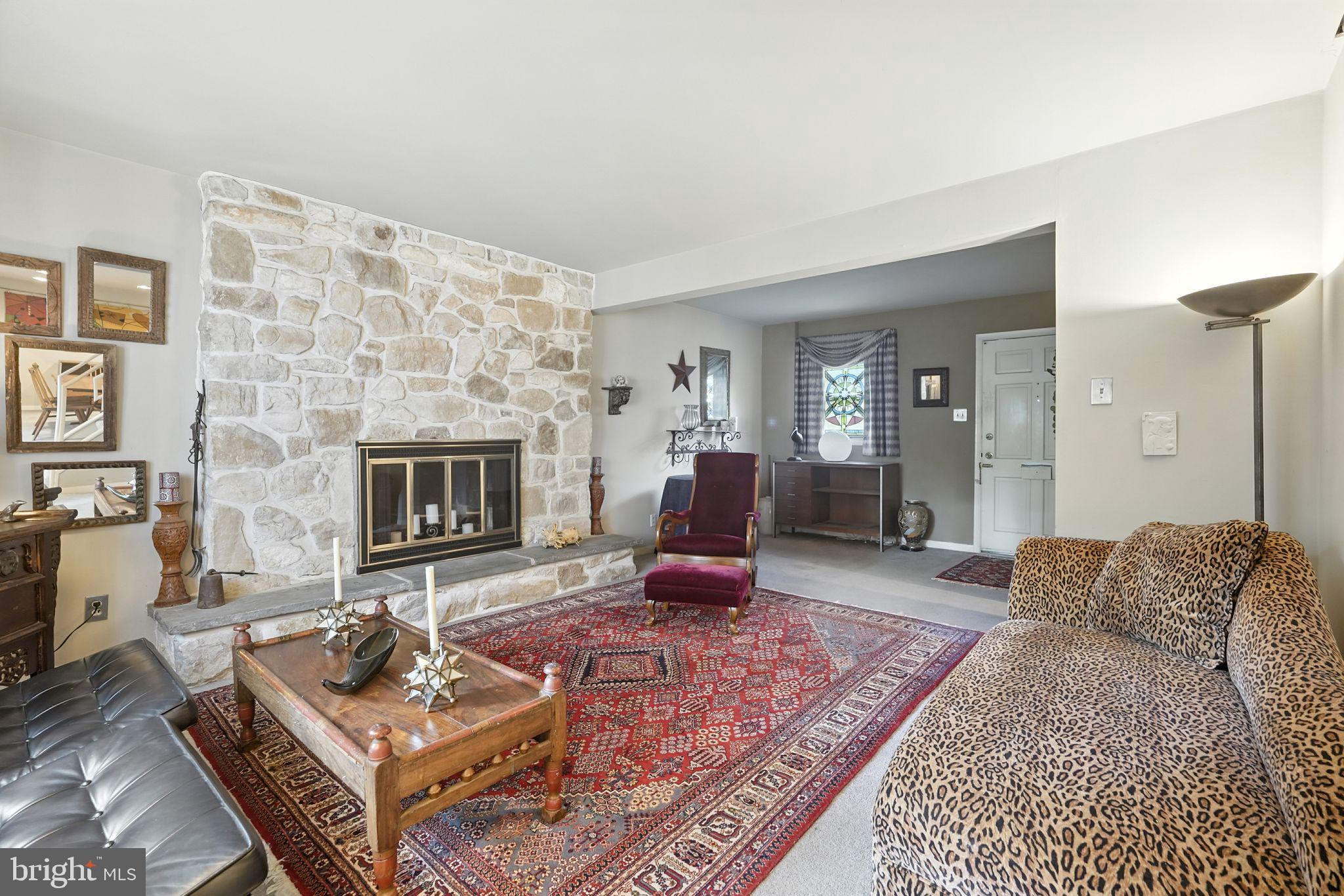 8420 Chippewa Road Philadelphia, PA 19128 - Photo 3 of 30 a living room with furniture and a fireplace