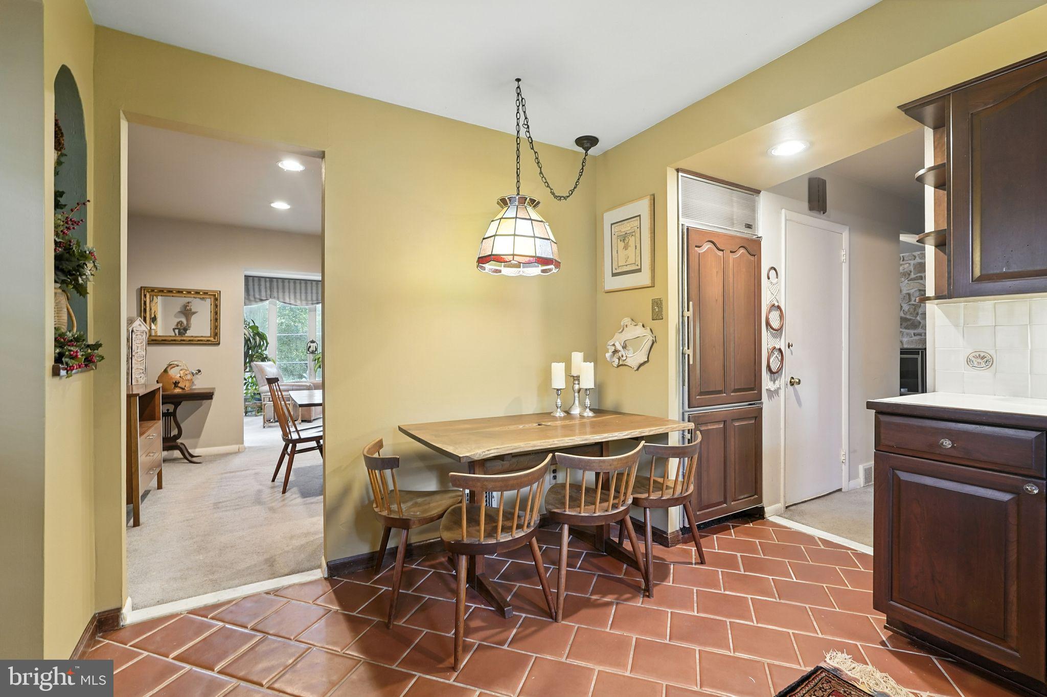 8420 Chippewa Road Philadelphia, PA 19128 - Photo 7 of 30 a dining room with stainless steel appliances kitchen island granite countertop a table and chairs