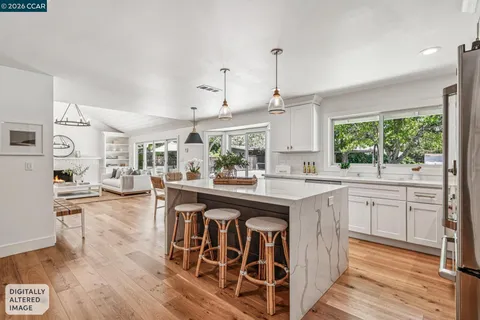 a stove top oven sitting inside of a kitchen