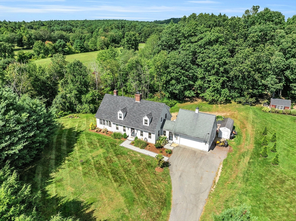 71B South Road Pepperell, MA 01463 - Photo 1 of 42 an aerial view of a house with a yard
