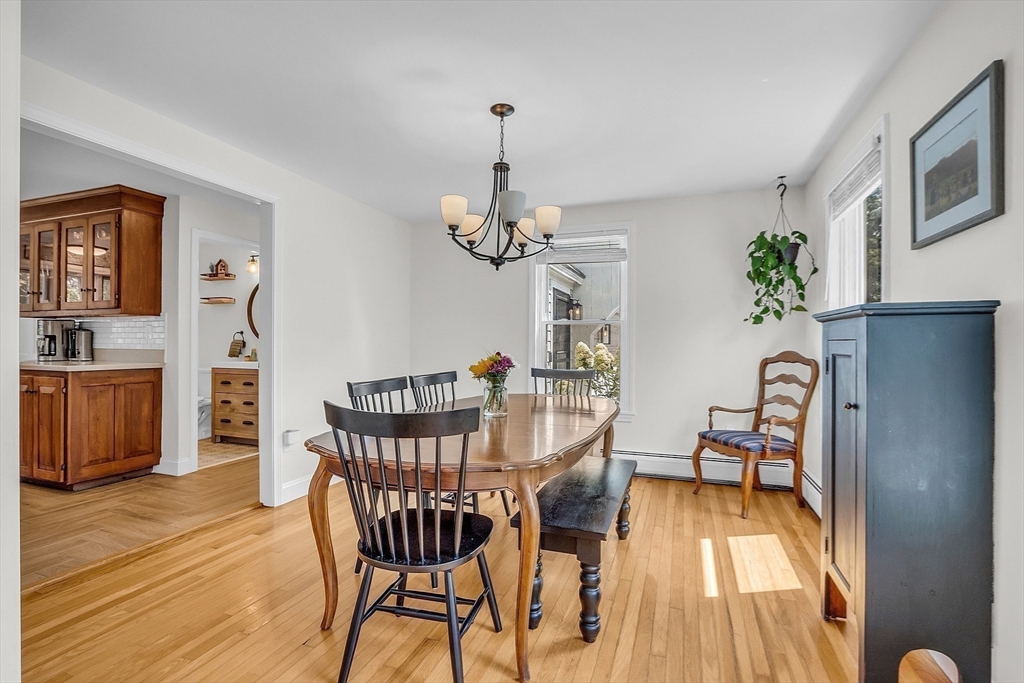 71B South Road Pepperell, MA 01463 - Photo 11 of 42 a view of a dining room with furniture window and wooden floor