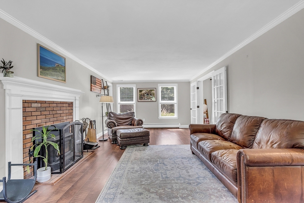 71B South Road Pepperell, MA 01463 - Photo 13 of 42 a living room with furniture and a fireplace