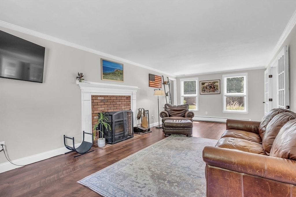 71B South Road Pepperell, MA 01463 - Photo 16 of 42 a living room with furniture and a fireplace