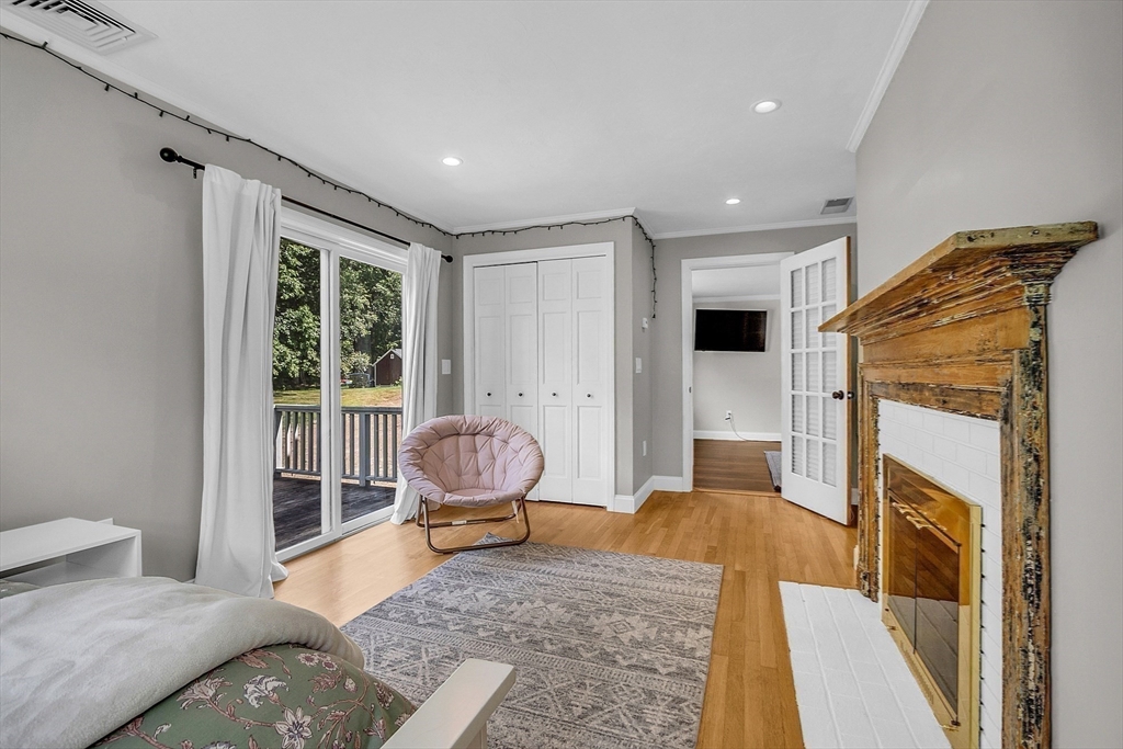 71B South Road Pepperell, MA 01463 - Photo 21 of 42 a living room with furniture and a fireplace