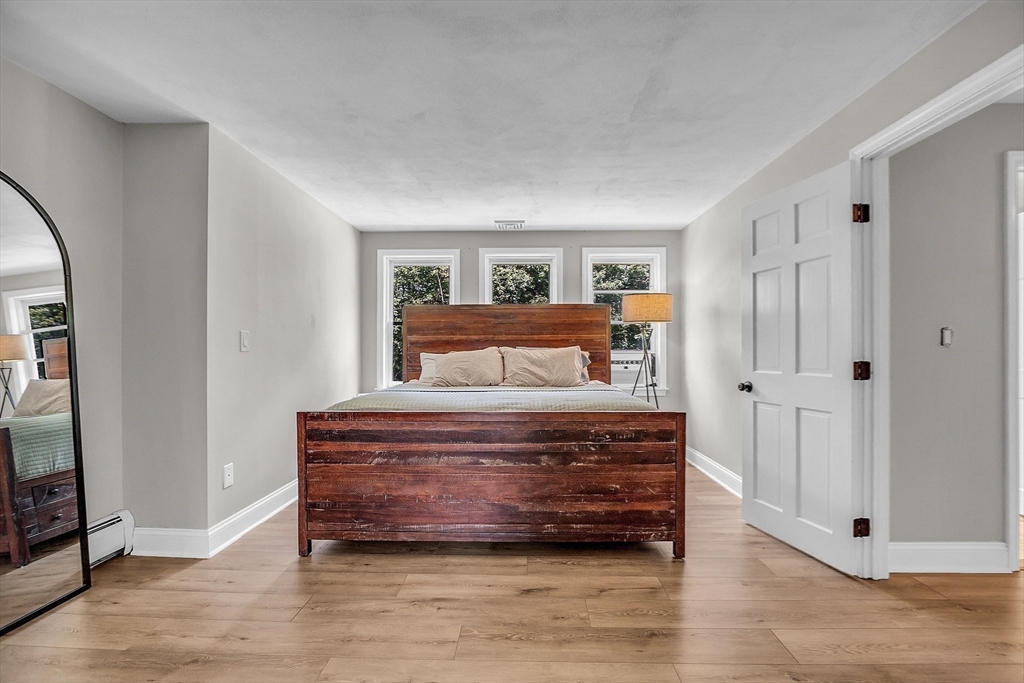 71B South Road Pepperell, MA 01463 - Photo 25 of 42 a bedroom with a bed and a mirror