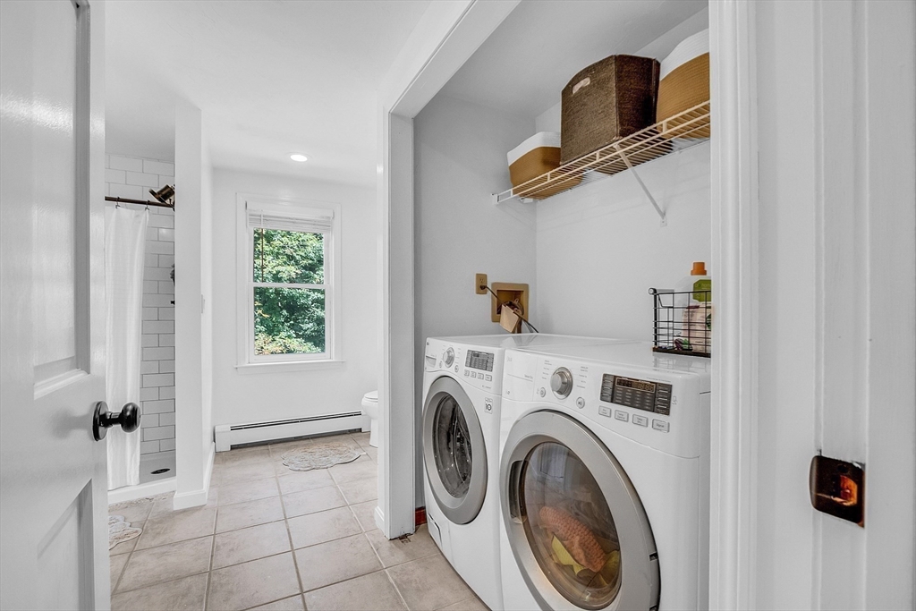 71B South Road Pepperell, MA 01463 - Photo 29 of 42 a view of storage and utility room with washer and dryer