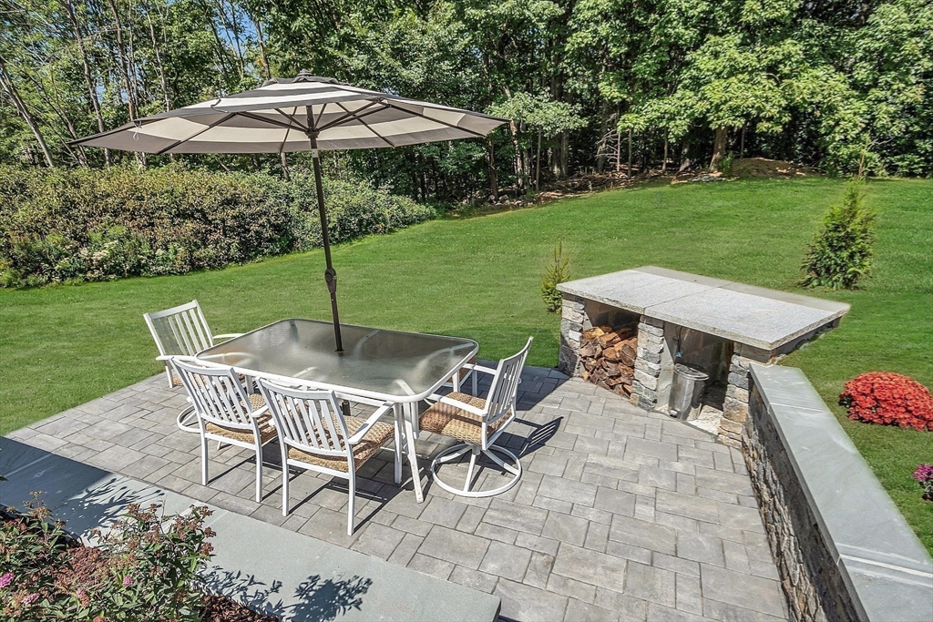 71B South Road Pepperell, MA 01463 - Photo 35 of 42 a patio with table and chairs