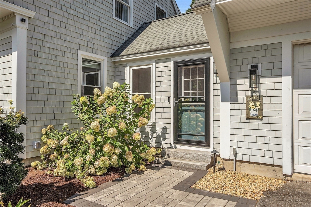 71B South Road Pepperell, MA 01463 - Photo 4 of 42 a front view of a house with a garden