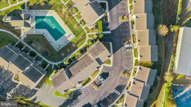 an aerial view of a house with a garden and plants