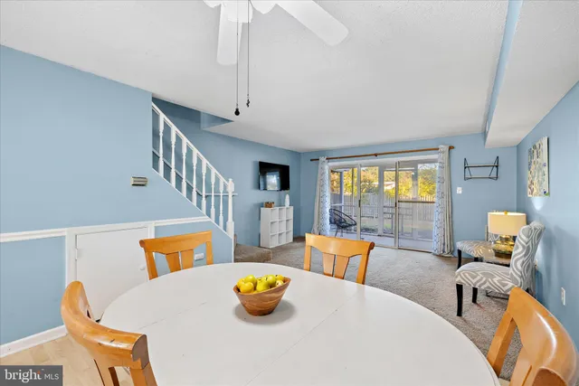 a living room with dining table and a couch