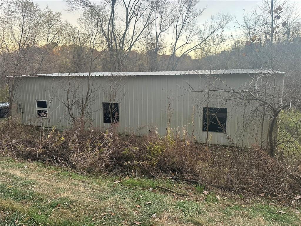0 Old Leechburg Road Pittsburgh, PA 15239 - Photo 8 of 10 a backyard of a house with lots of plants and wooden fence