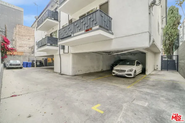 a car parked in parking area of a building