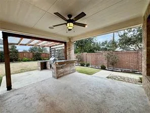 a view of swimming pool with wooden fence
