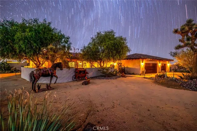 a view of a house with outdoor space and sitting area