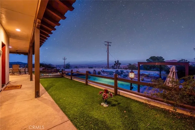 a view of a swimming pool with chairs